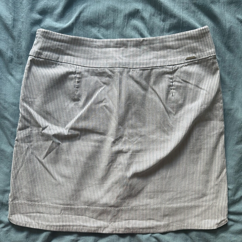Blue and white pinstriped scort